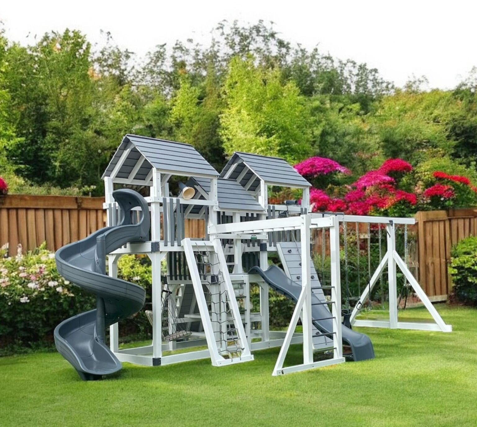 Backyard Playstations 303 Premium Vinyl Swing Set in Gray and white with Manicured backyard with cedar fence.