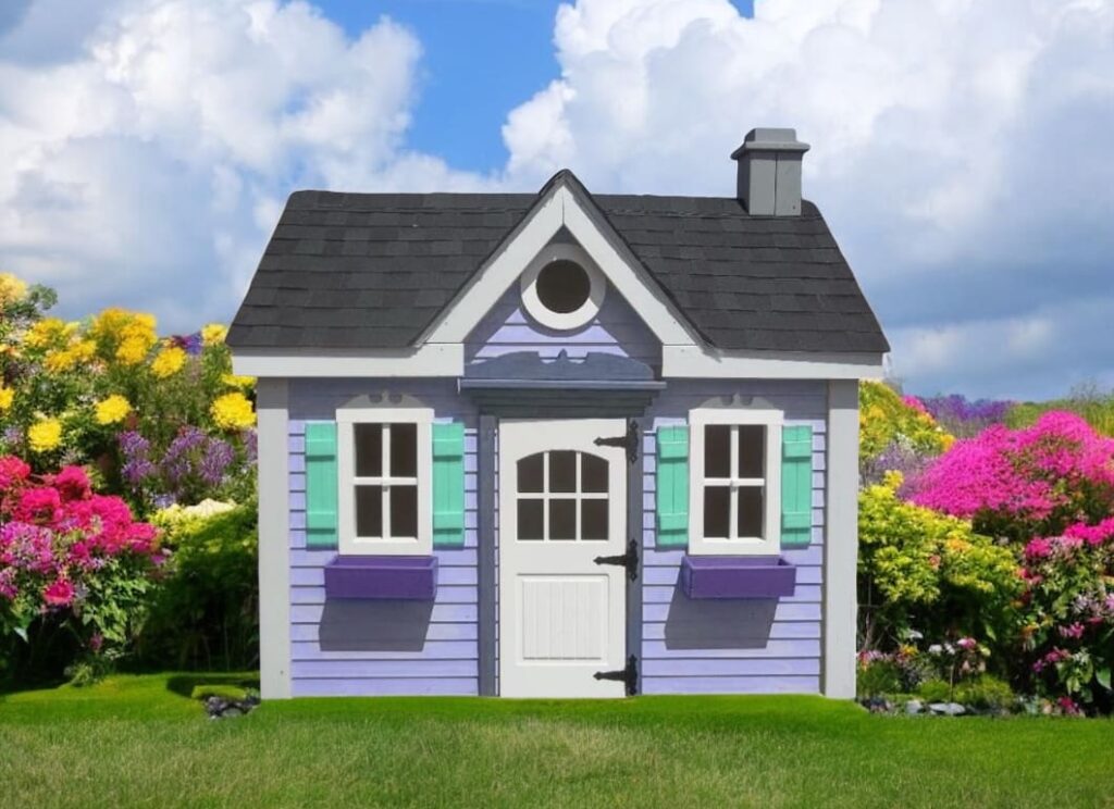 Custom Sweet Lilyanna Playhouse b=Made by Kinzerbilt an Amish Company in a Garden Bed with lush Green Grass.